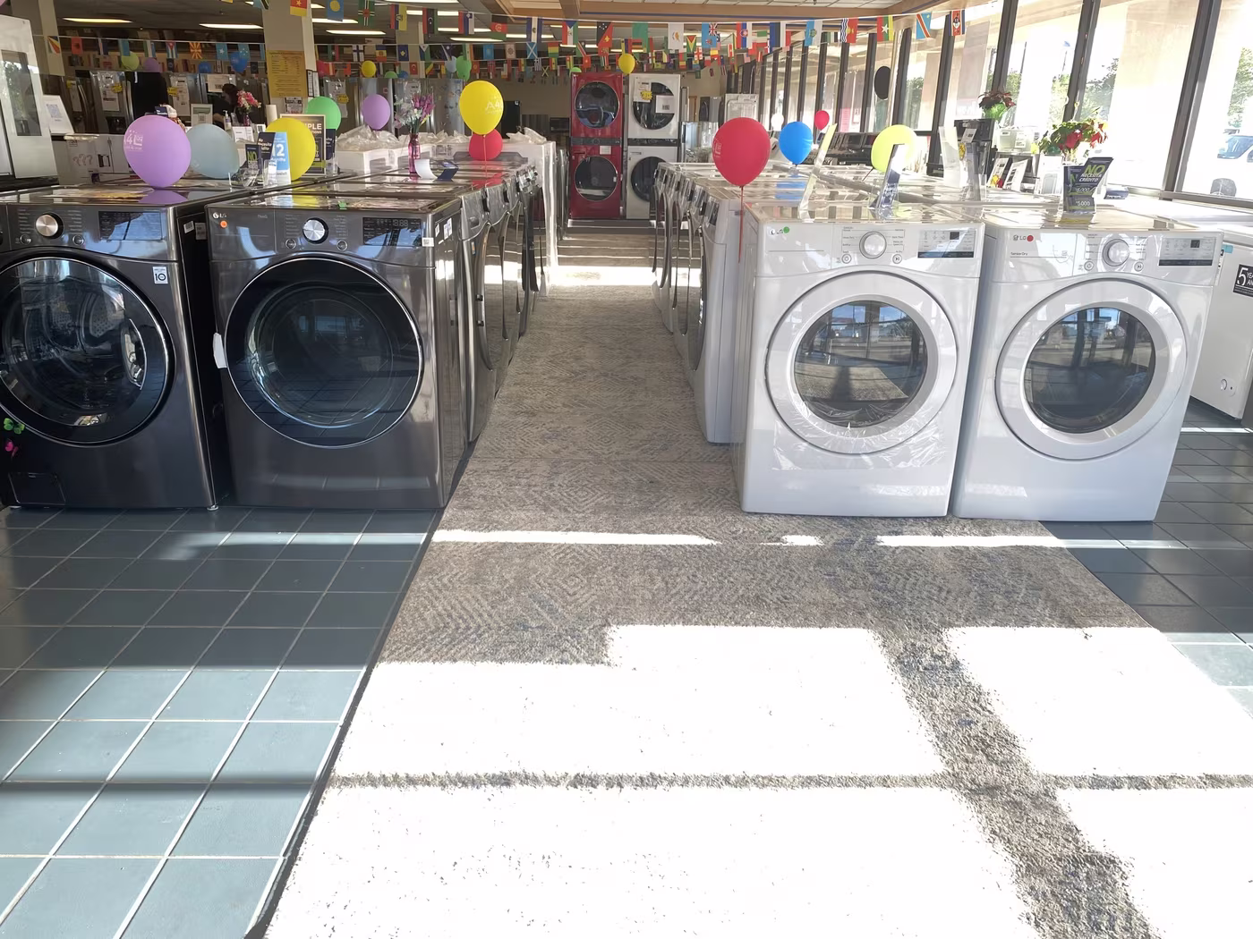 Front-load washers and dryers under party balloons