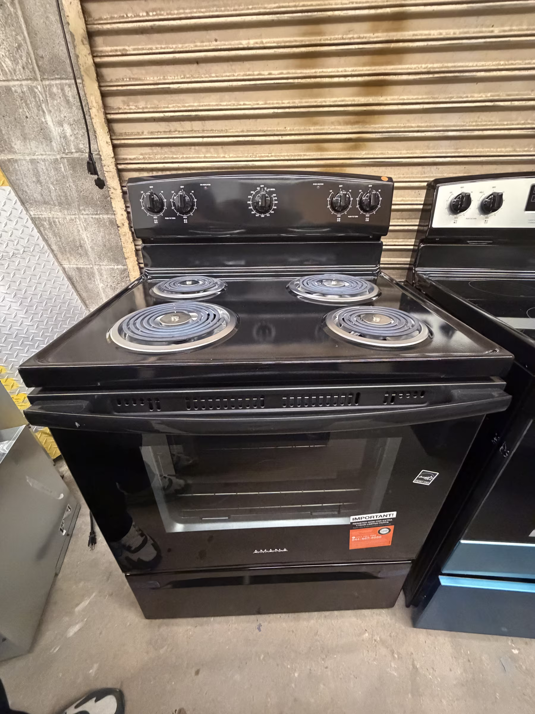 AMANA 30 in. 4 Elements Freestanding Electric Range in Black with Extra-Large Oven Window AFCS2530TB