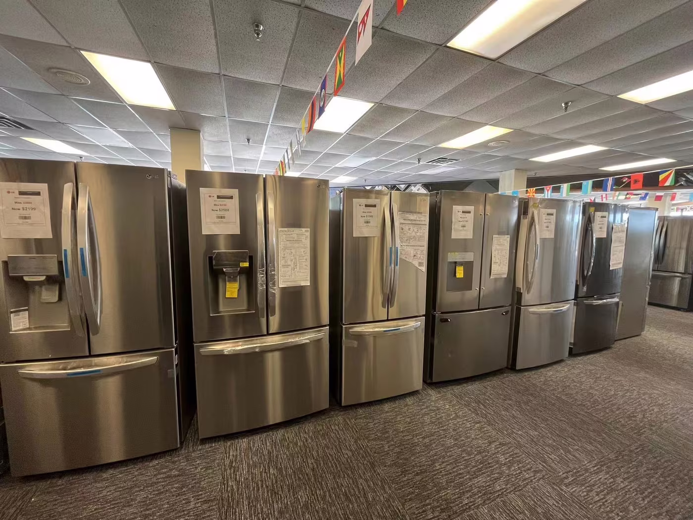 A row of stainless refrigerators on our showroom floor